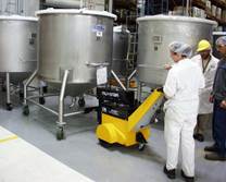 A picture containing indoor, person, preparing, working Description automatically generated