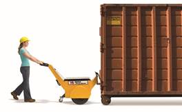 A person pushing a yellow forklift Description automatically generated with medium confidence